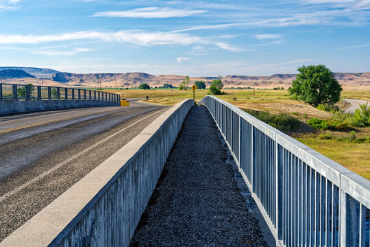 The road and walkway over the Yellowtail Afterbay Dam on the Bighorn River in Fort Smith, Montana, USA