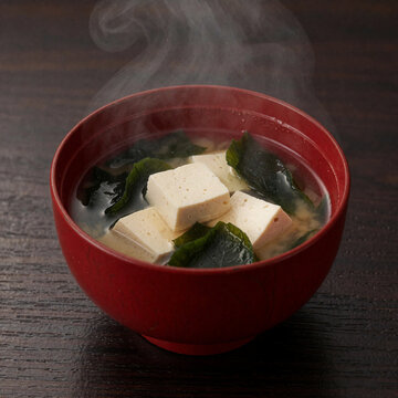 Hot Miso Soup with Tofu and Wakame in a Red Lacquer Bowl Generative AI