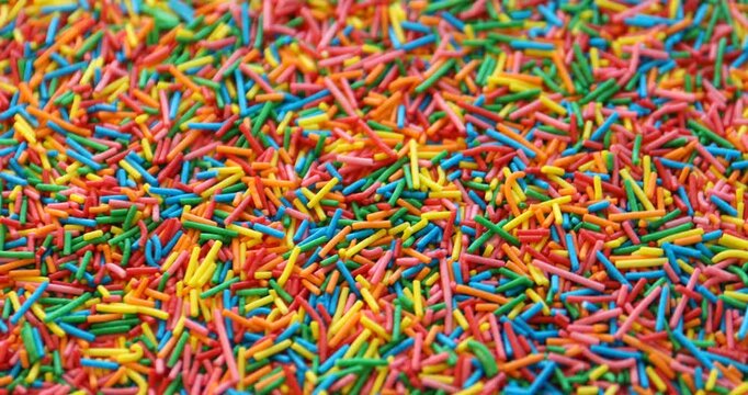 Many bright rainbow sprinkles. Decoration for dessert