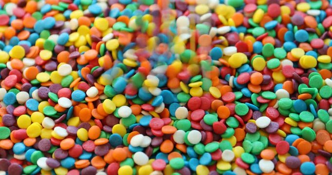 Many bright confetti sprinkles. Decoration for dessert
