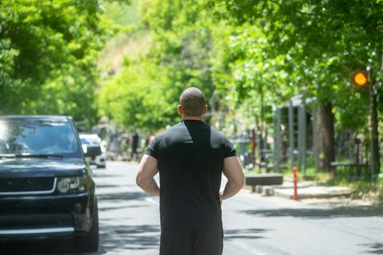 A man running along the road