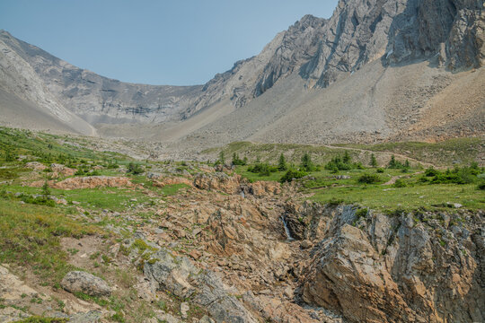 Ptarmigan cirque hiking trail in Kanananskis Country, Alberta, Canada during summertime with huge expansive views in the alpine valley of the Canadian Rockies. 