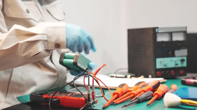 Technician handling lithium iron phosphate battery in workshop Great for clean energy campaigns, EV content, or sustainable tech education
