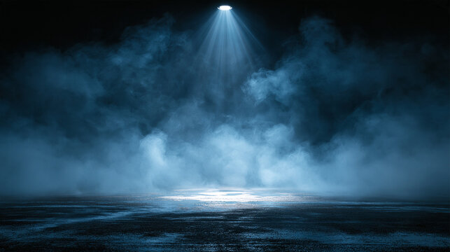 Dramatic blue spotlight shining through heavy smoke onto a dark stage floor. Ideal for product presentation backgrounds and moody design projects.