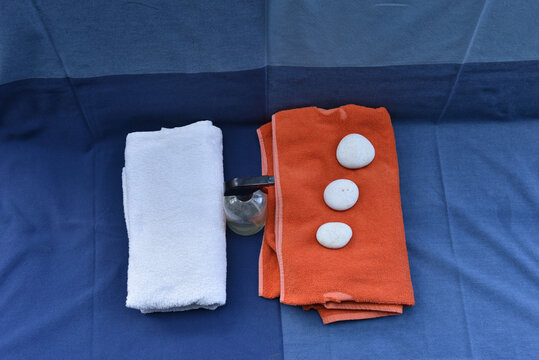 Personal care wellness set with towels spray bottle and spa stones