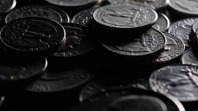 Money background, pile of silver dollar and quarter coins in dark light, cash savings and wealth