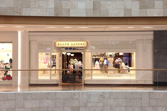 The elegant storefront and window display of a Ralph Lauren luxury clothing store inside the upscale Deji Plaza shopping mall in Nanjing, Jiangsu, China