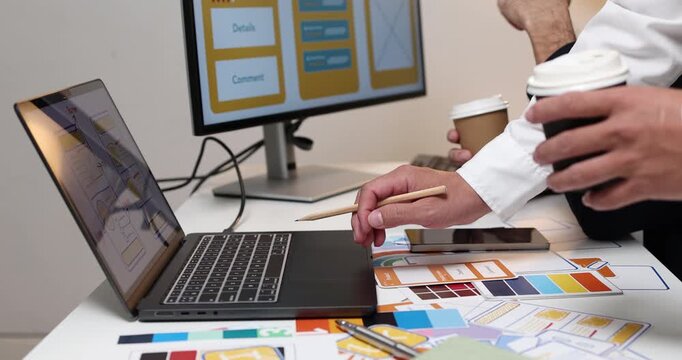 UX UI design and user experience development, featuring creative professionals collaborating on interface layouts, reviewing design prototypes, and refining visual elements to create intuitive.