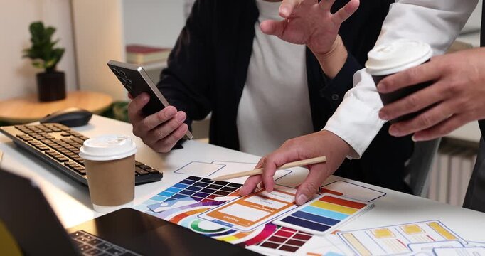UX UI design and user experience development, featuring creative professionals collaborating on interface layouts, reviewing design prototypes, and refining visual elements to create intuitive.