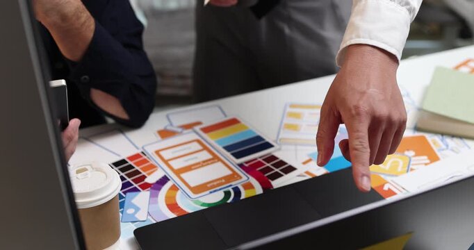 UX UI design and user experience development, featuring creative professionals collaborating on interface layouts, reviewing design prototypes, and refining visual elements to create intuitive.