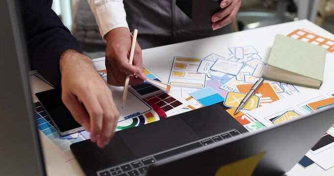 UX UI design and user experience development, featuring creative professionals collaborating on interface layouts, reviewing design prototypes, and refining visual elements to create intuitive.