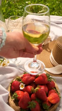 Picnic with strawberries and wine. Selective focus.