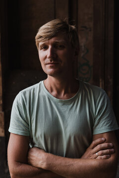 Confident man in a casual t shirt with arms crossed
