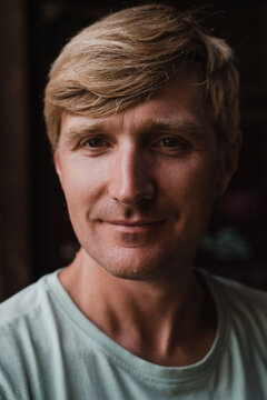 Close up portrait of a friendly blond man smiling