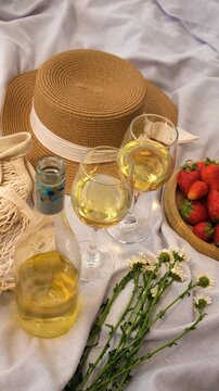 Picnic with strawberries and wine. Selective focus.