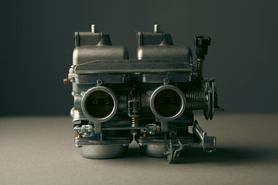 Motorcycle engine on a wooden background. toning.