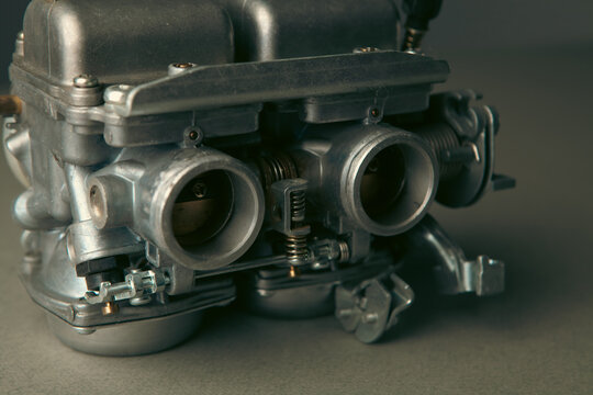 Motorcycle engine on a wooden background. toning.