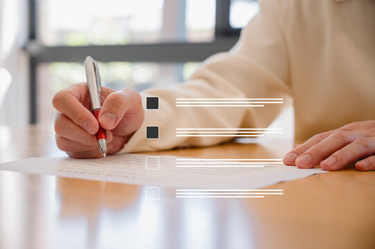 Businessman use pen review document and analysing report, utilizing intelligent management system to validate records and streamline final approvals, Digital document workflow and quality assurance