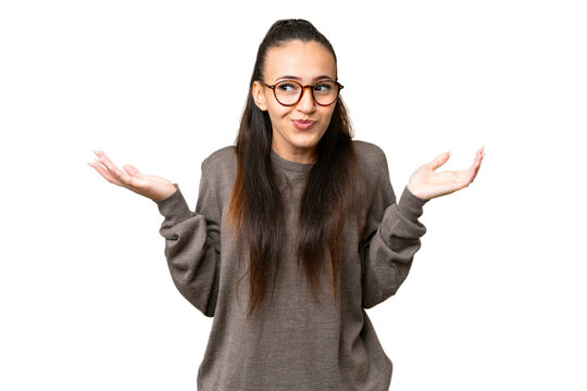 Young Arabian woman over isolated chroma key background having doubts while raising hands