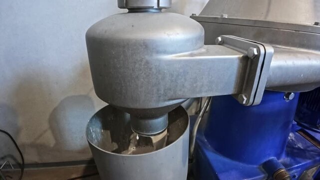 A video of liquid separator machine operating at a beverage manufacturing plant during filtration process.