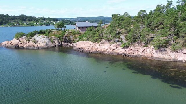 Aerial Drone View of Rocky Beach and Clear Coastal Water Near Svelvik, Norway