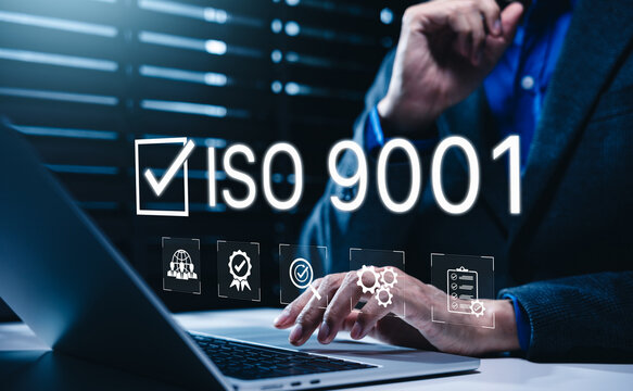 ISO 9001 standard certification and quality control concept. Auditor using laptop with icons of international compliance, approved checklist, inspection, business governance policy, workflow assurance