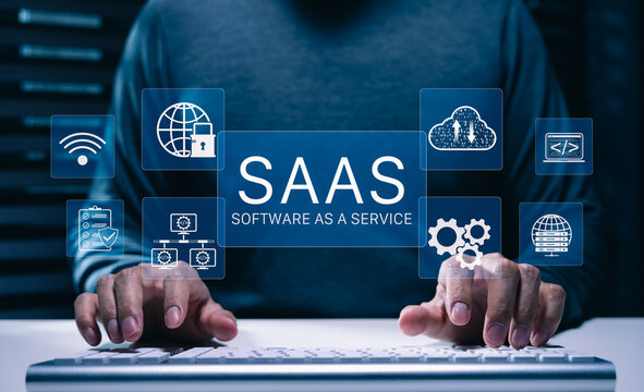 SaaS Concept, Software as a Service, Person typing on keyboard with digital icons representing various aspects of Software as a Service (SaaS), emphasizing modern technology platforms, cloud computing