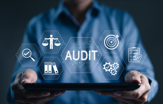 Audit compliance and corporate risk assessment concept. professional holding tablet with icons of financial inspection checklist, law justice balance scales, business target goal, governance, doc file
