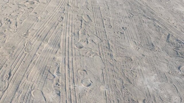 Wind-swept sand with clear impressions and ripples