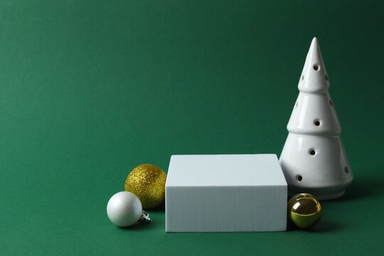 Christmas product display scene featuring square podium and decorations. Ideal for holiday marketing projects