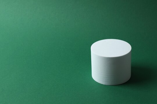 White podium on green background
