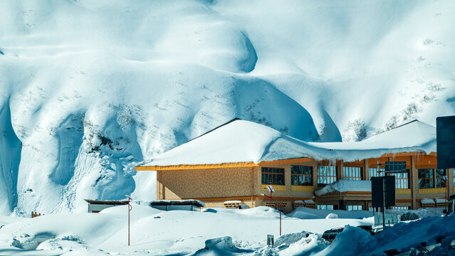 Building under heavy snow drifts at Galongla Mountain, Medog, Nyingchi, Xizang