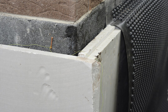 Foundation waterproofing with xps foam insulation and protection waterproof membrane outdoors
