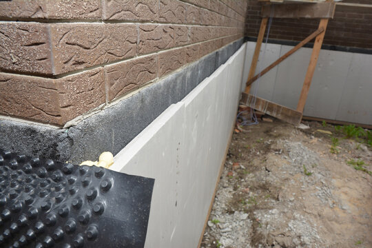 House foundation insulation with waterproofing