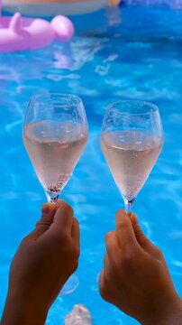 Champagne by the pool. Selective focus.