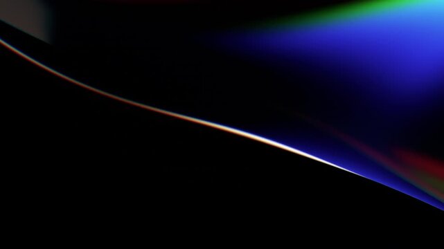 Rainbow light dispersion flowing over a curved glass edge on a dark black background, optics and light spectrum concept, seamless loop, 3d rendered animation