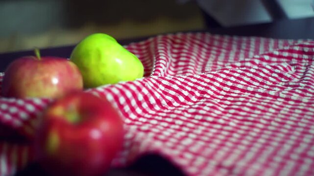 Apple pie springform pan placed checkered towel. Closeup ripe red fruit table.