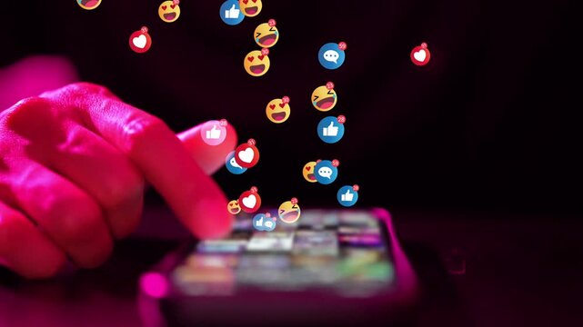 Social media reactions, finger tapping smartphone with emoji, like and heart icons in pink light
