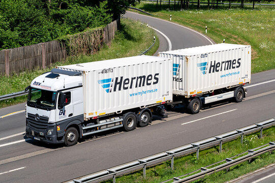 Wiehl, Germany - May 27, 2026: hsv Systemverkehre Mercedes-Benz Actros truck with Hermes swop bodies on motorway