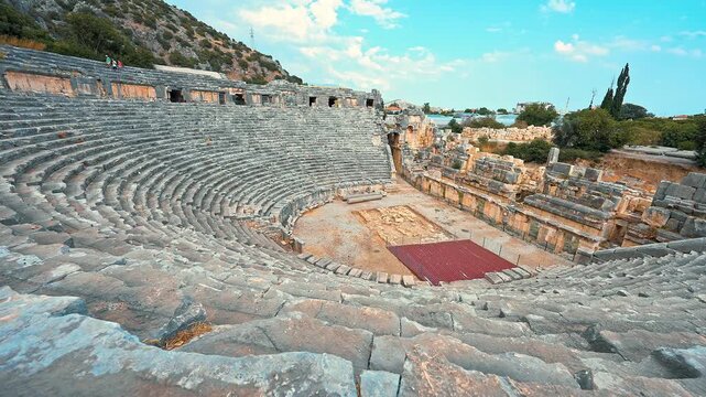 Myra Ancient Theatre in Demre, Antalya, Turkiye is captured from a left-to-right panning angle.