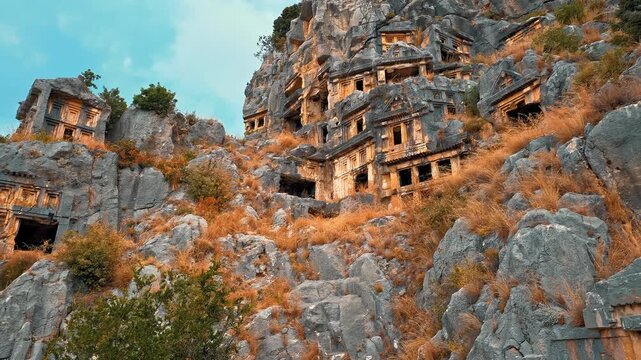 Myra Ancient City in Antalya, Turkiye, showcases magnificent rock tombs carved into towering cliffs, reflecting the timeless legacy of Lycian civilization.