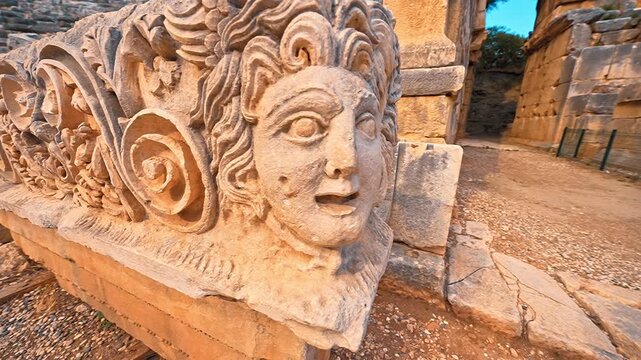Myra Ancient City in Demre, Antalya, showcases intricate stone face carvings in a close up, revealing the artistry of ancient civilizations.