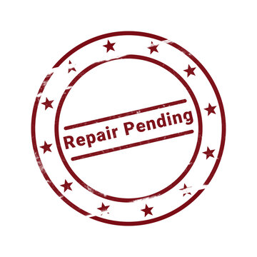 Red rubber stamp with repair pending text