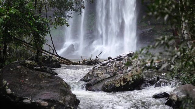 Waterfall and Rocky Rapids Deep in Tropical Forest