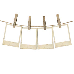 Four empty polaroid photo frames hanging on a rope © Raja
