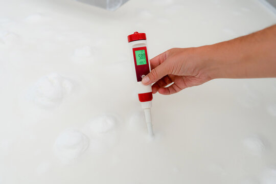 Hand use pH meter to test milk acidity