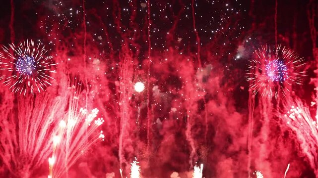 Amazing real beautiful colorful fireworks background on celebration night event for happy new year party or independence day, Abstract Multi color golden firework in the night sky