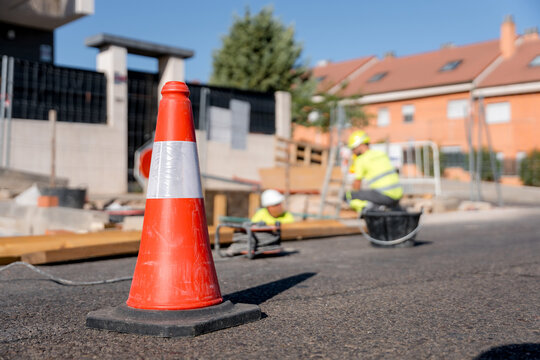 Traffic cone mark water leak repair on residential street