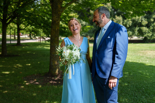 Happy couple celebrate civil wedding in sunny park
