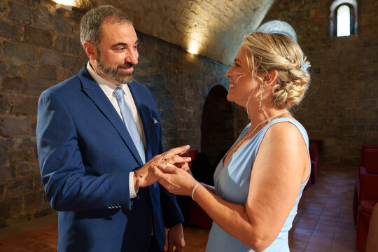Couple exchange rings during civil wedding ceremony